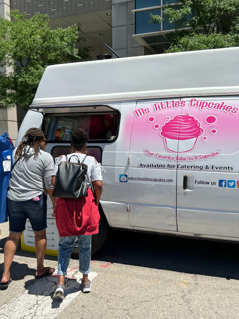Ms Tittle's Cupcakes food truck parked at the festival