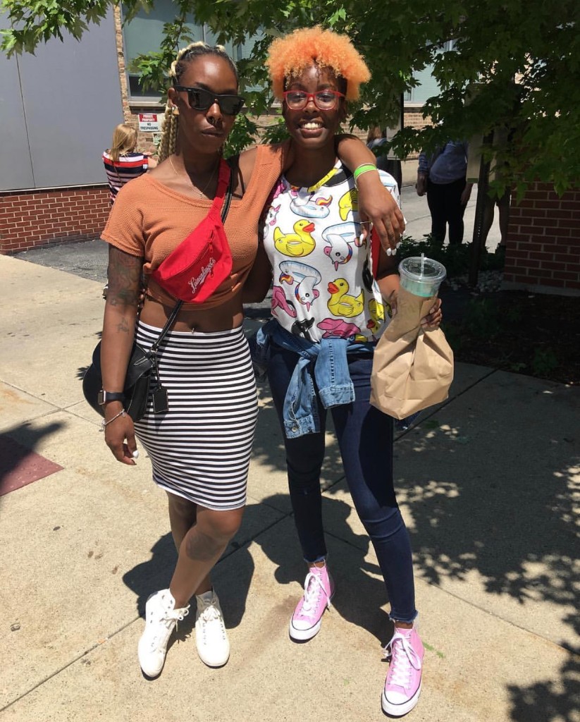 Two friends posing on the sidewalk at Chicago Food Truck Festival