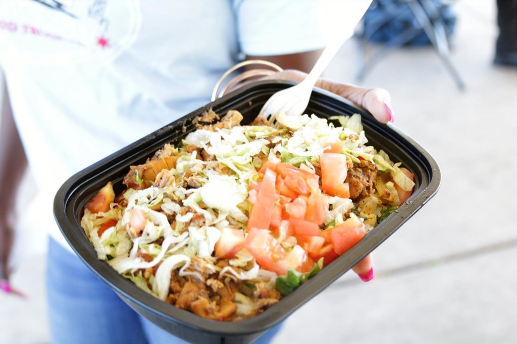 Loaded bowl with lettuce, tomato, and seasoned meat