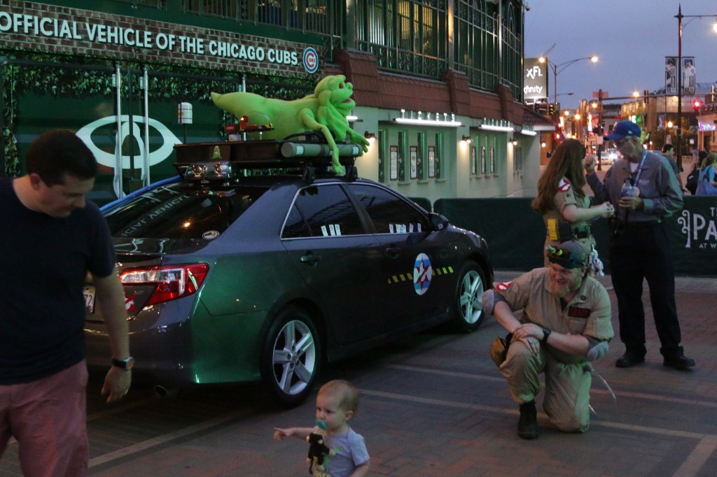 Themed promotional vehicle and guests in costume outside Wrigley Field during a movie night